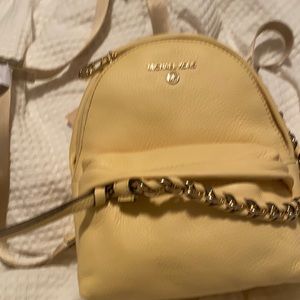 Authentic Michael Kors yellow mini backpack with removable straps
